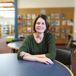 Amy sits at the Perkasie library